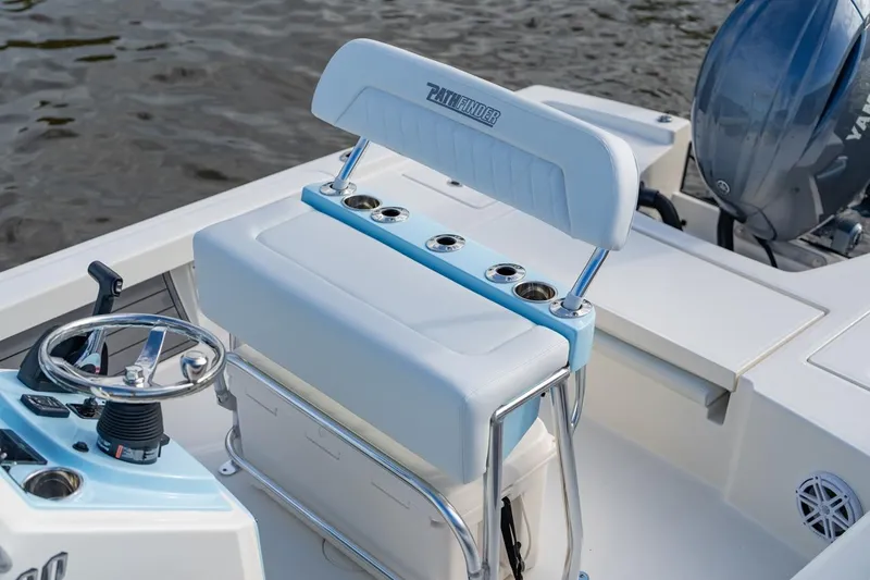 Slide: The Image of 2026 Pathfinder 2200 TRS boat interior with steering wheel and seating. - 45