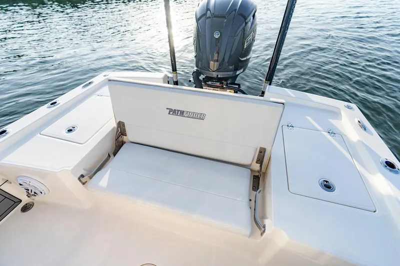 Slide: The Image of 2026 Pathfinder 2200 TRS boat with seating and motor on calm water. - 46