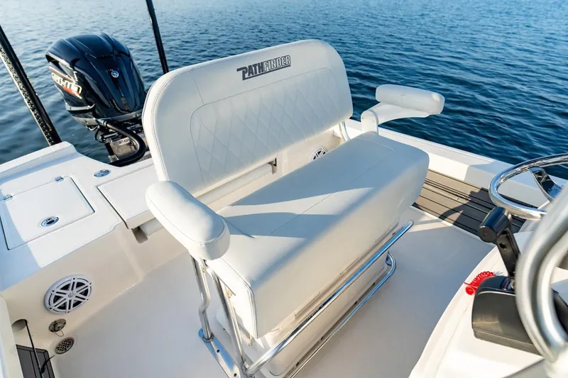 Slide: The Image of Pathfinder 2200 TRS boat interior with seating and motor, 2026 model on water. - 47
