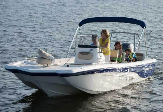 The Image of Manufacturer Provided Image: 2014 NauticStar 210 Angler boat cruising on water with passengers. - 0