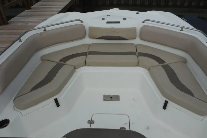 Slide: The Image of 2014 NauticStar 210 Angler boat interior with cushioned seating and railings. - 16