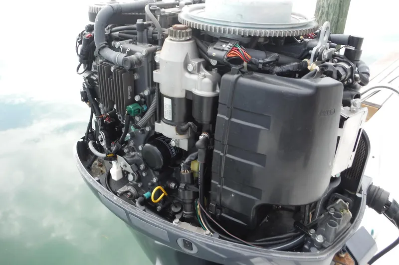 Slide: The Image of 2014 NauticStar 210 Angler boat engine, detailed view of components and wiring. - 23