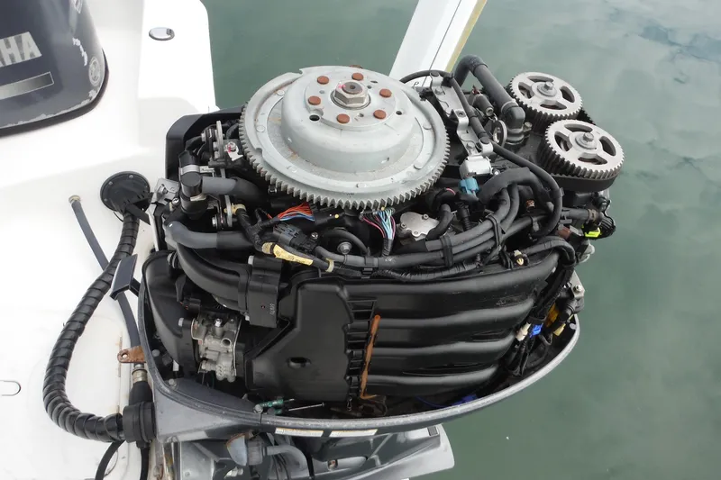 Slide: The Image of 2014 NauticStar 210 Angler boat engine, detailed view of mechanical components. - 24