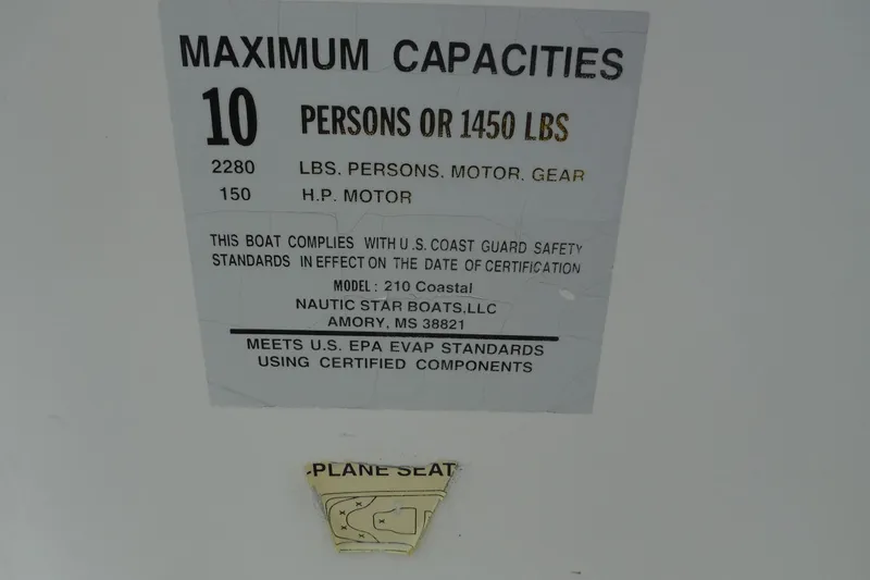 Slide: The Image of 2014 NauticStar 210 Angler capacity label, 10 persons or 1450 lbs, 150 HP motor. - 25