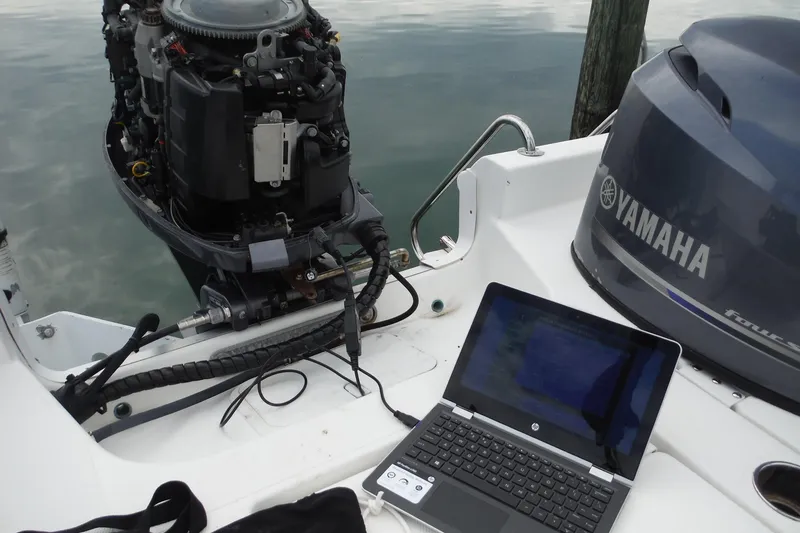 Slide: The Image of Laptop diagnosing Yamaha outboard engine on 2014 NauticStar 210 Angler boat. - 28