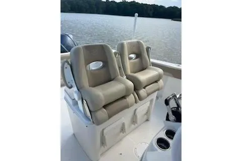 Slide: The Image of 2017 Sailfish 320 CC boat with dual cushioned seats on deck. - 3