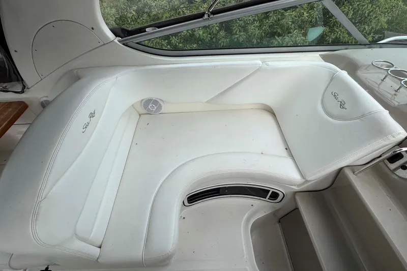 Slide: The Image of 2007 Sea Ray 280 Sundancer interior with white seating and sleek design. - 10