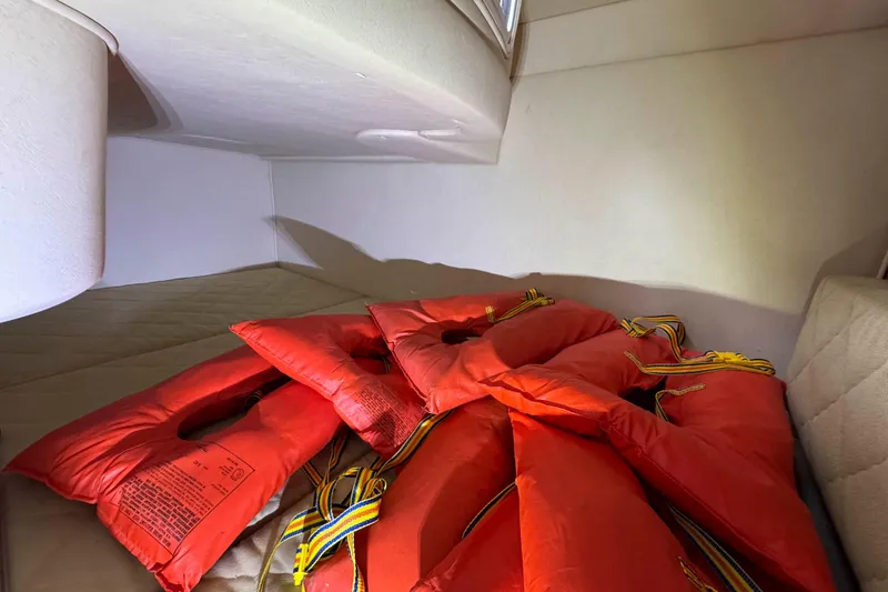 Slide: The Image of Red life jackets in cabin of 2007 Sea Ray 280 Sundancer boat. - 17