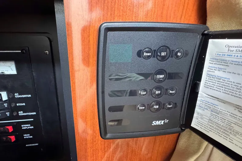 Slide: The Image of Control panel on a 2007 Sea Ray 280 Sundancer boat, featuring temperature settings. - 18