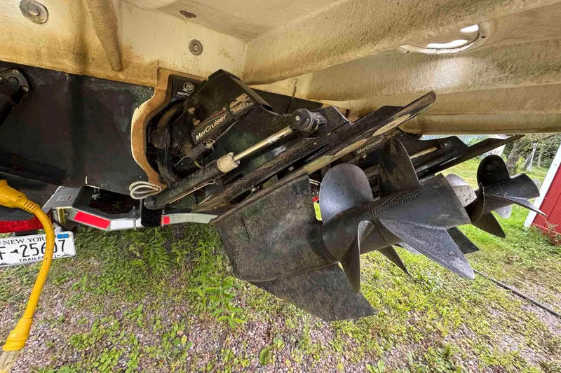 Slide: The Image of 2007 Sea Ray 280 Sundancer with MerCruiser Bravo Three outdrive, parked on grass. - 21