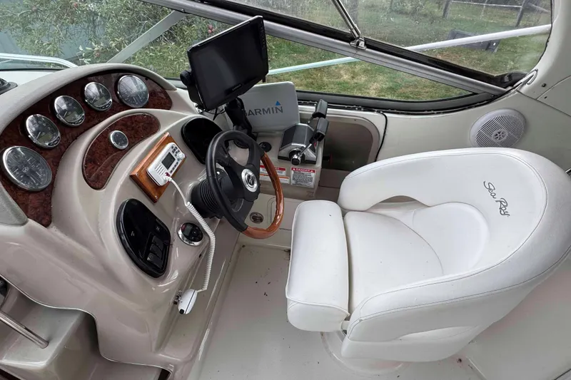 Slide: The Image of Cockpit of 2007 Sea Ray 280 Sundancer with steering wheel and navigation equipment. - 4