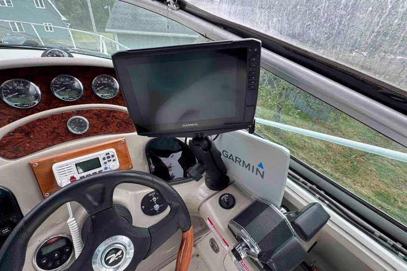 Slide: The Image of 2007 Sea Ray 280 Sundancer helm with Garmin navigation system and control panel. - 9