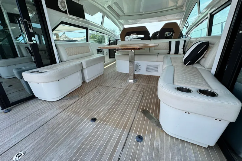 Slide: The Image of Luxurious interior of 2018 Beneteau Gran Turismo 46 yacht with elegant seating and table. - 17