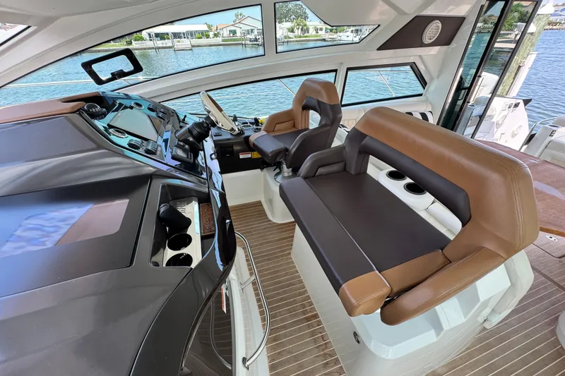 Slide: The Image of Interior of 2018 Beneteau Gran Turismo 46 yacht with modern helm and seating. - 24