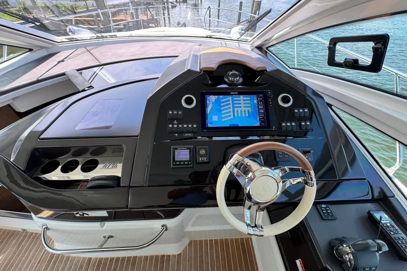 Slide: The Image of Cockpit of 2018 Beneteau Gran Turismo 46 yacht with modern navigation system and steering wheel. - 25