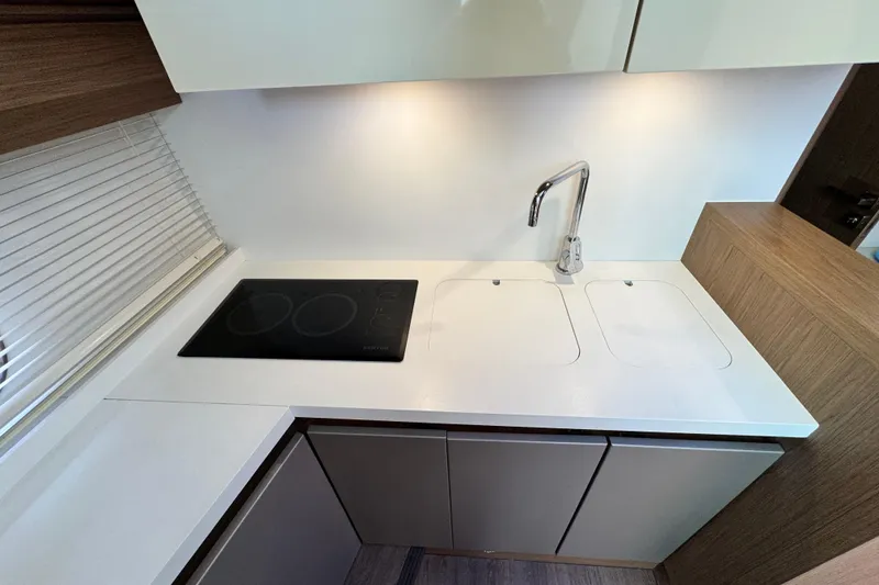 Slide: The Image of Modern kitchen area in 2018 Beneteau Gran Turismo 46 yacht with sleek design. - 29