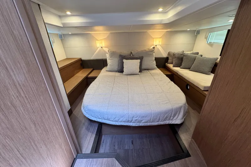 Slide: The Image of Luxurious cabin interior of 2018 Beneteau Gran Turismo 46 yacht with cozy bedding and seating. - 33