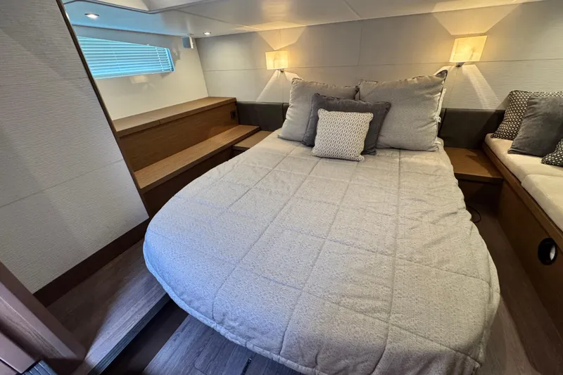 Slide: The Image of Luxurious cabin interior of 2018 Beneteau Gran Turismo 46 yacht with cozy bedding. - 34