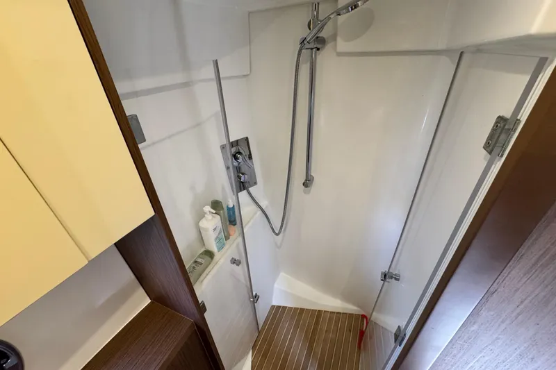 Slide: The Image of Shower area in 2018 Beneteau Gran Turismo 46 yacht, featuring modern fixtures and wooden flooring. - 38