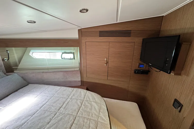 Slide: The Image of Luxurious cabin interior of 2018 Beneteau Gran Turismo 46 yacht with TV and window. - 40
