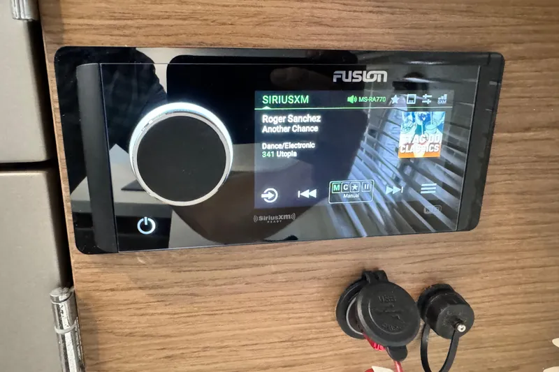 Slide: The Image of Fusion audio system on 2018 Beneteau Gran Turismo 46, displaying SiriusXM interface. - 52
