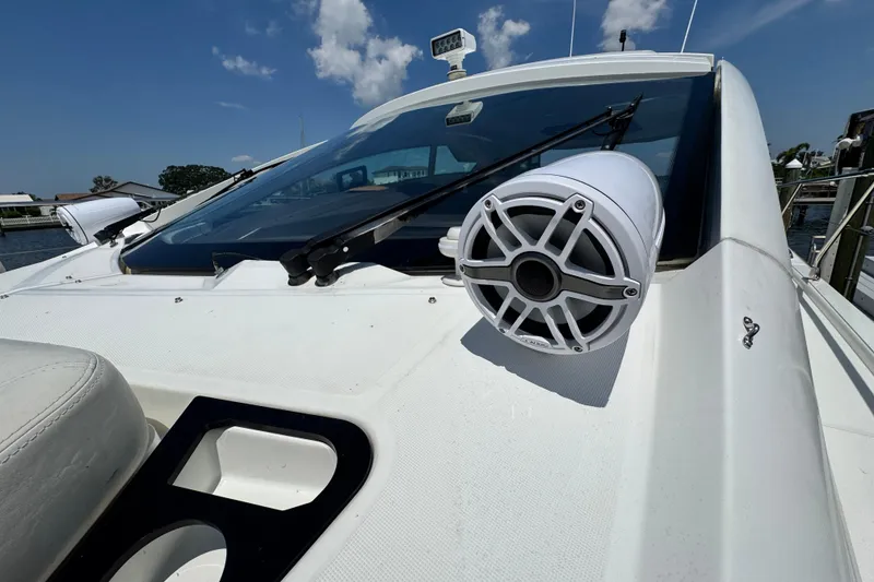 Slide: The Image of 2018 Beneteau Gran Turismo 46 yacht with speaker and windshield detail under clear sky. - 54