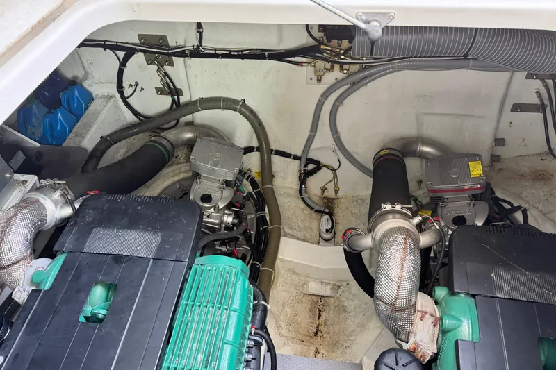 Slide: The Image of Engine room of 2018 Beneteau Gran Turismo 46, showcasing dual engines and mechanical components. - 59