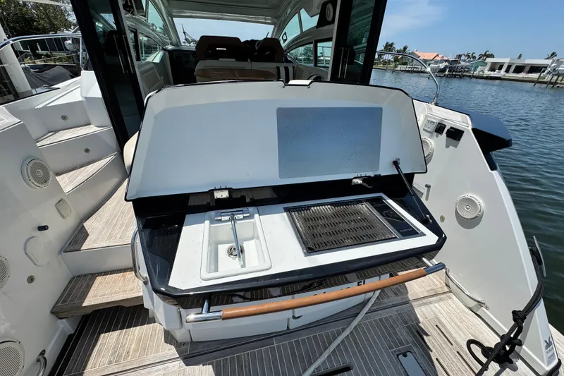 Slide: The Image of 2018 Beneteau Gran Turismo 46 yacht with outdoor grill and sink on deck. - 9