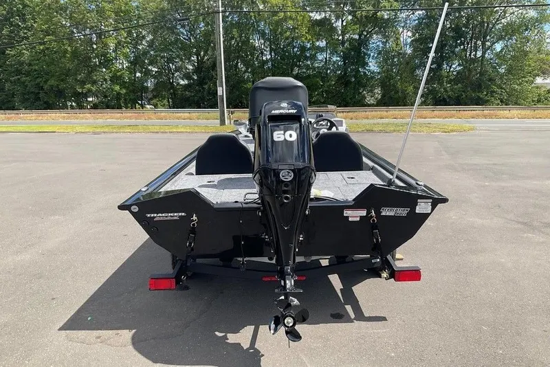 Slide: The Image of 2025 Tracker Pro Team 175 boat with Mercury 60 engine, parked outdoors. - 10