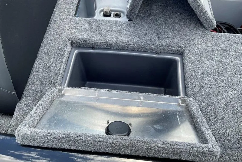 Slide: The Image of 2025 Tracker Pro Team 175 boat interior with carpeted storage compartment. - 14