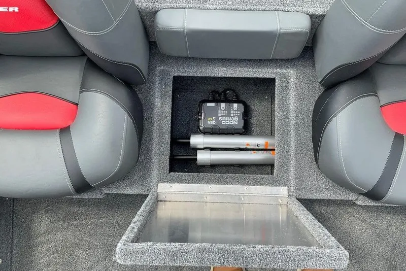 Slide: The Image of 2025 Tracker Pro Team 175 boat interior with storage compartment and equipment. - 20