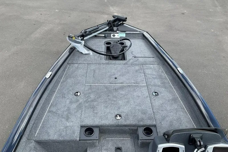 Slide: The Image of 2025 Tracker Pro Team 175 boat deck with trolling motor and storage compartments. - 24
