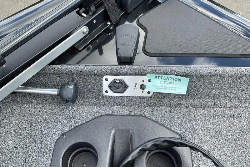 Slide: The Image of 2025 Tracker Pro Team 175 boat dashboard with control panel and customer notice. - 26