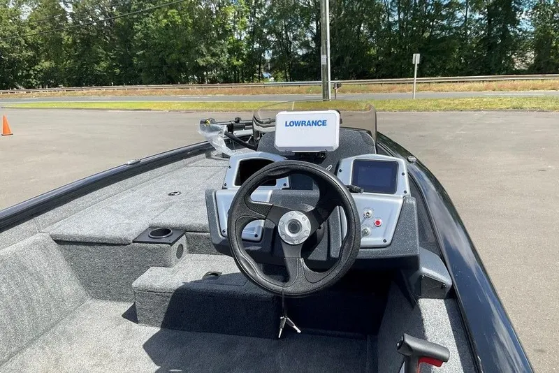 Slide: The Image of 2025 Tracker Pro Team 175 boat interior with steering wheel and Lowrance navigation system. - 28