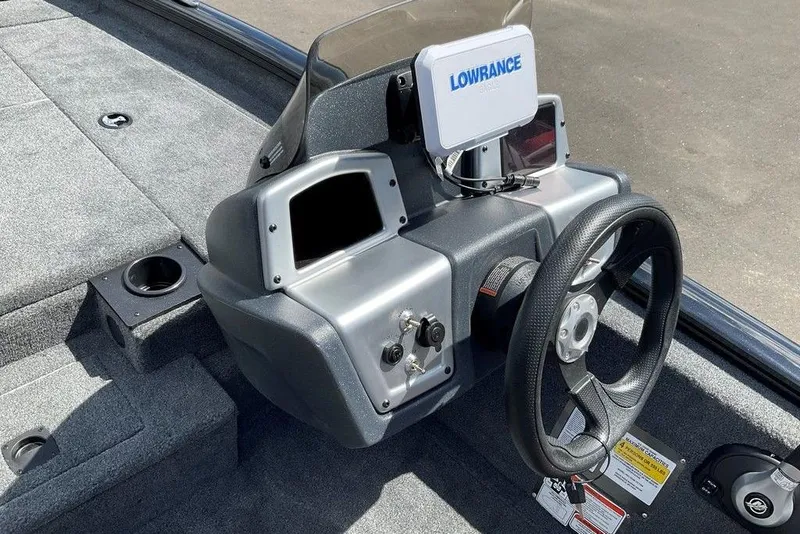 Slide: The Image of 2025 Tracker Pro Team 175 boat dashboard with Lowrance electronics and steering wheel. - 29