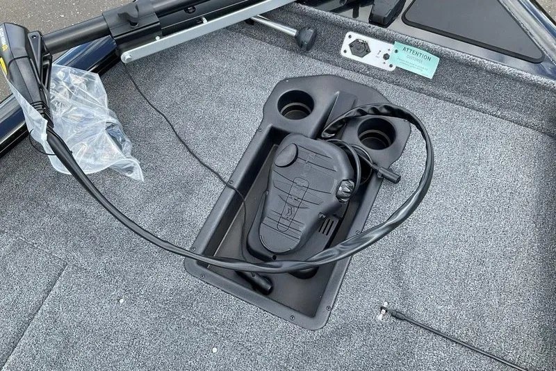 Slide: The Image of 2025 Tracker Pro Team 175 boat deck with foot pedal and cup holders. - 30
