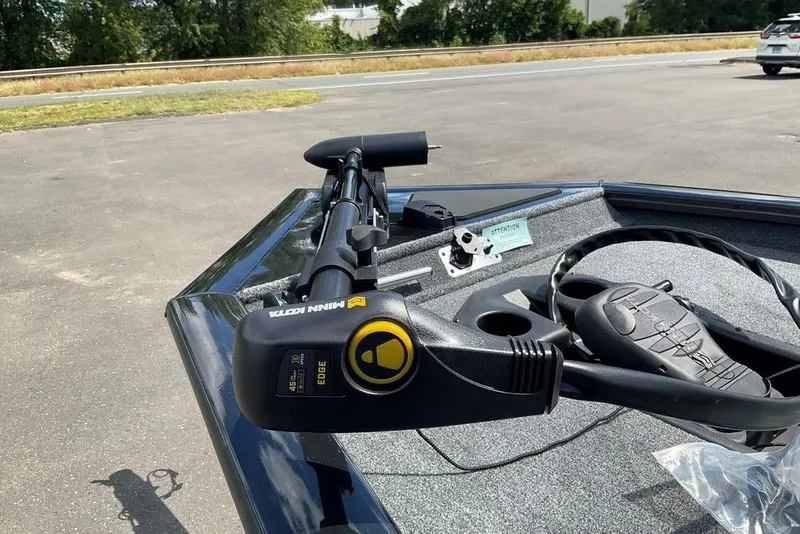 Slide: The Image of 2025 Tracker Pro Team 175 boat with Minn Kota trolling motor on deck. - 33