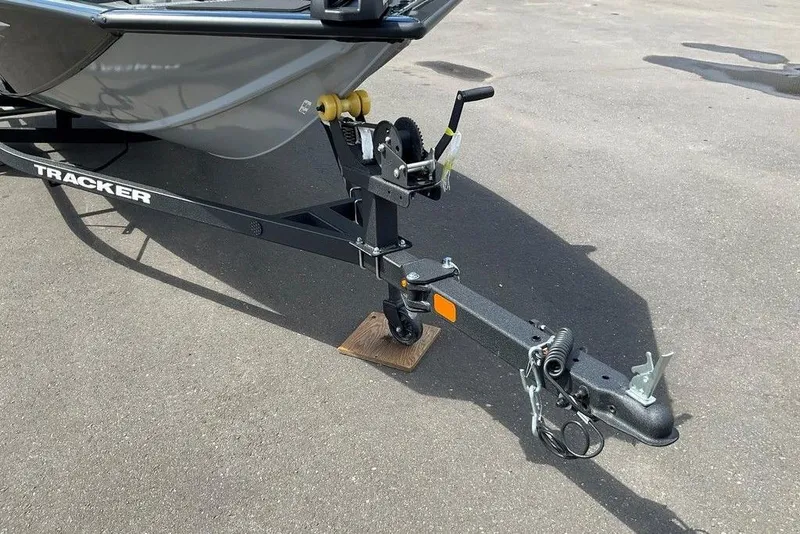 Slide: The Image of Trailer hitch of 2025 Tracker Pro Team 175 boat on pavement. - 34