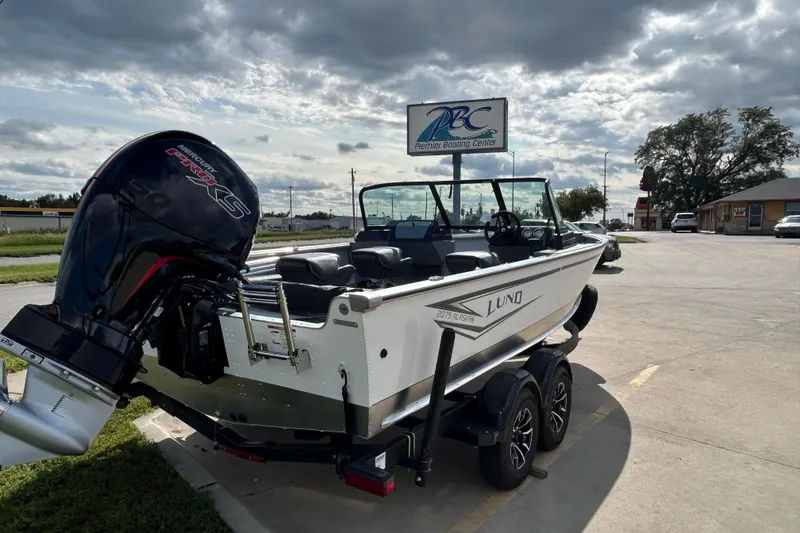 Slide: The Image of 2026 Lund 2075 Alaskan Sport boat with Mercury engine at Premier Boating Center. - 11
