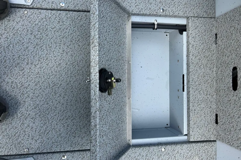 Slide: The Image of Open storage compartment in 2026 Lund 2075 Alaskan Sport boat interior. - 17