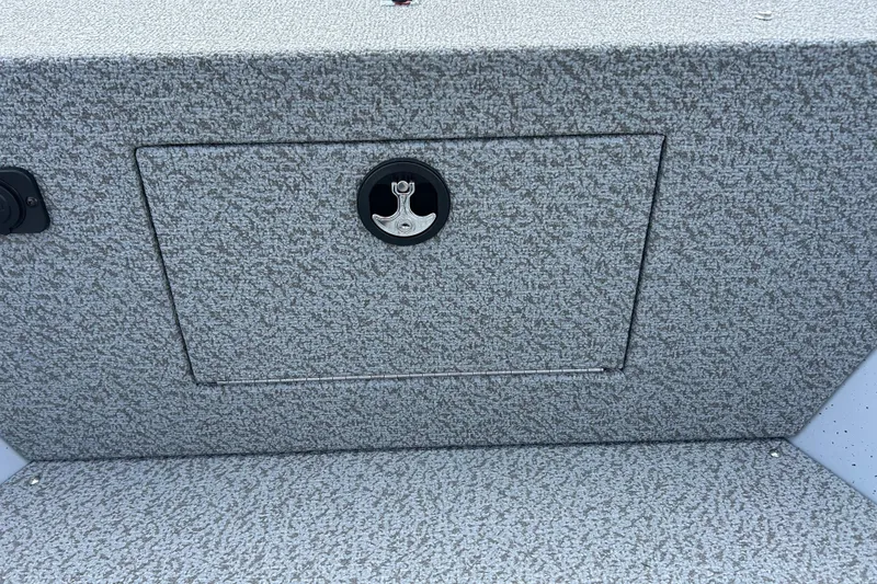 Slide: The Image of 2026 Lund 2075 Alaskan Sport boat interior with textured storage compartment. - 22