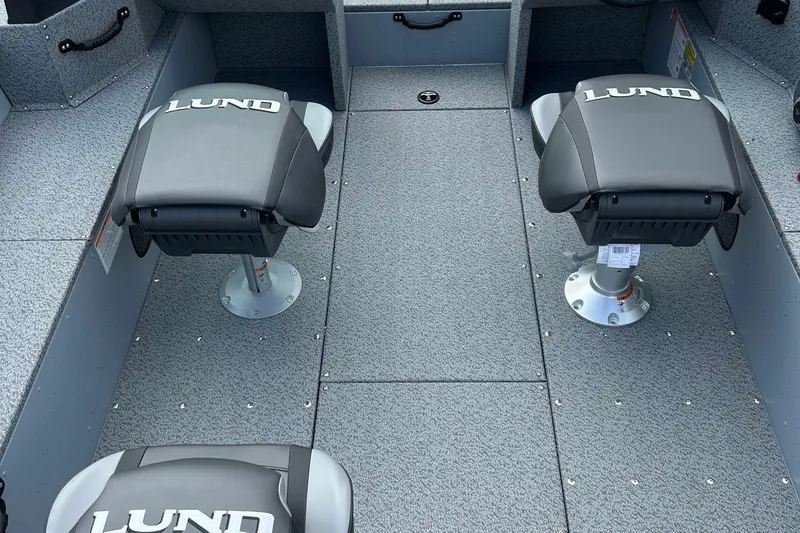 Slide: The Image of 2026 Lund 2075 Alaskan Sport boat interior with two swivel seats. - 25