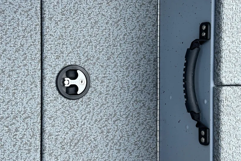 Slide: The Image of 2026 Lund 2075 Alaskan Sport boat deck with latch and handle detail. - 28