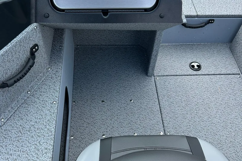 Slide: The Image of 2026 Lund 2075 Alaskan Sport boat interior with gray textured flooring. - 29