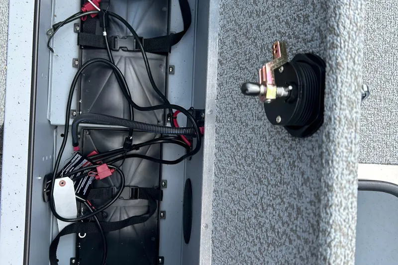 Slide: The Image of Interior wiring of 2026 Lund 2075 Alaskan Sport boat, featuring electrical components and toggle switch. - 31