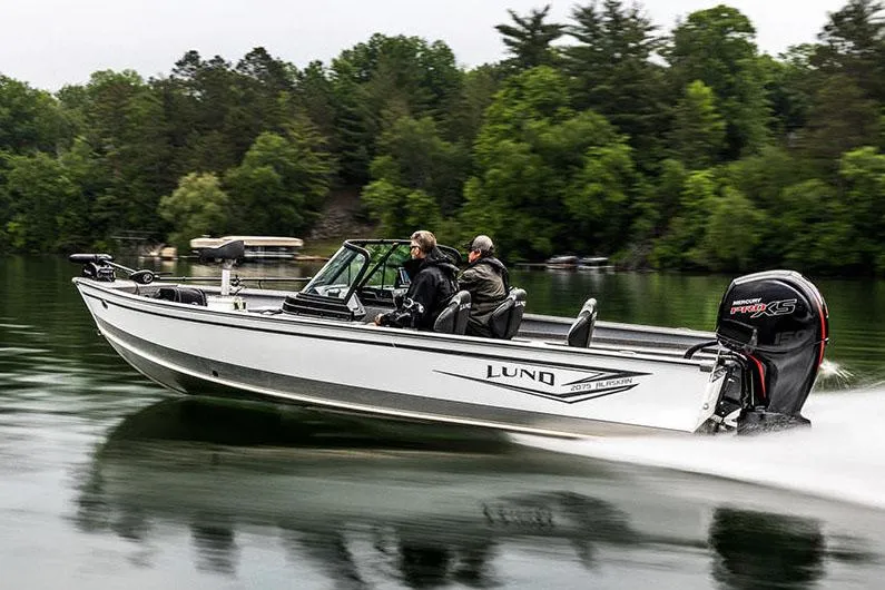 Slide: The Image of Manufacturer Provided Image: 2025 Lund 2075 Alaskan Sport boat cruising on a serene lake. - 33