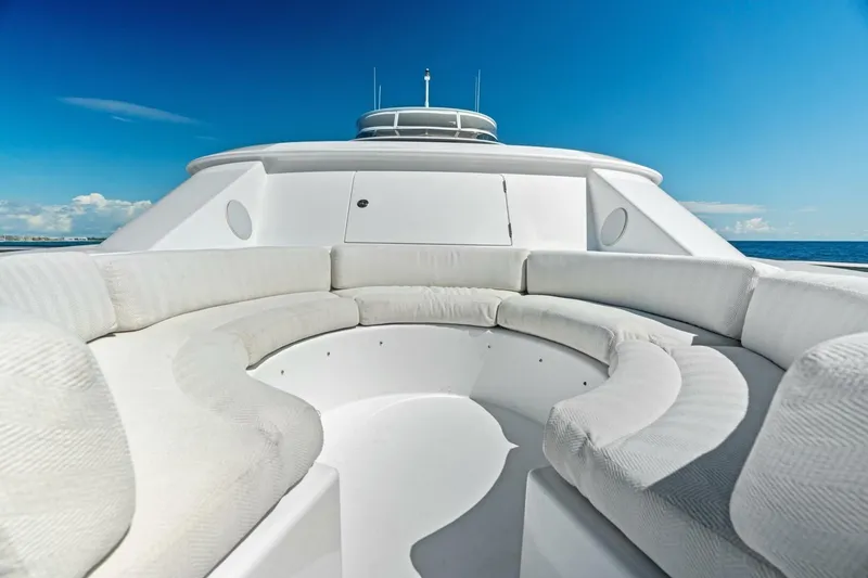 Slide: The Image of Luxurious 2011 Westport yacht with spacious white seating under clear blue skies. - 14