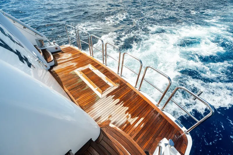 Slide: The Image of Luxurious 2011 Westport yacht deck with wooden finish, overlooking ocean waves. - 15