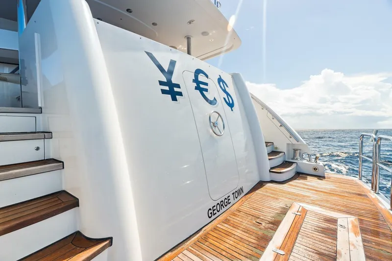 Slide: The Image of Luxury Westport 2011 yacht deck with currency symbols, George Town registration, ocean view. - 16