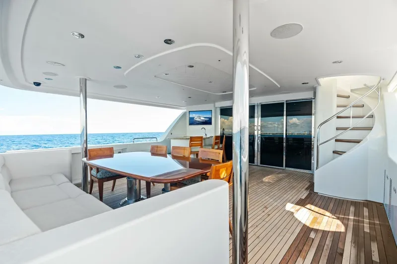 Slide: The Image of Luxurious 2011 Westport yacht deck with elegant seating, dining area, and ocean view. - 17